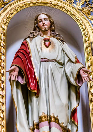 LUGO (RA), ITALY - MAY 27, 2019: light is enlightening the Sacred Heart in statue of Jesus Christ in Saint James Churchのeditorial素材