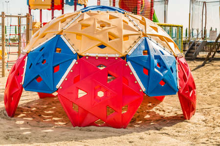 CERVIA (RA), ITALY - MAY 17, 2019: sunlight is enlightening playgrounds on sandy beach of Cerviaのeditorial素材