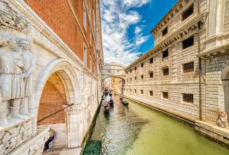 VENEZIA, ITALY â MAY 31, 2019: tourists on gondolas passing in Rio di Palazzo  typical water channel of Venice, under the famous Bridge of Sighsのeditorial素材