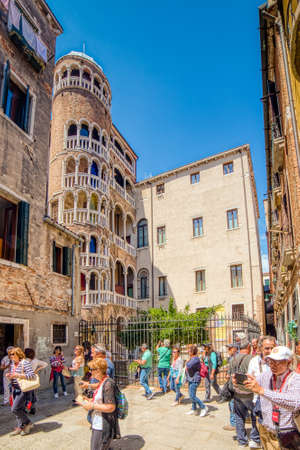 VENEZIA, ITALY - MAY 31, 2019: tourists are enjoying the amazing spiral staircase and the layered loggias of Palazzo Contarini del Bovolo in Veniceのeditorial素材