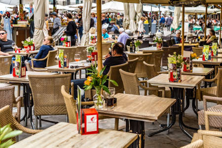 VERONA (VR), ITALY - MAY 10, 2019: tourists visiting the famous Piazzale delle Erbe, Herbs Square, and its typical market in Veronaのeditorial素材