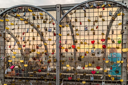 BRATISLAVA, SLOVAKIA - AUGUST 26, 2019: sunlight is enlightening love padlocks in Bratislava, capital of Slovakiaのeditorial素材