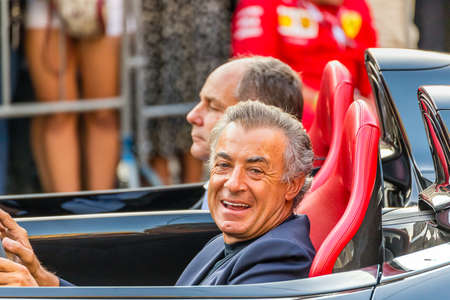 MILANO, ITALY - SEPTEMBER 4, 2019: the old F1 driver of Ferrari Racing, Jean Alesi driving car with Gerhard Berger at 90 Years Partyのeditorial素材