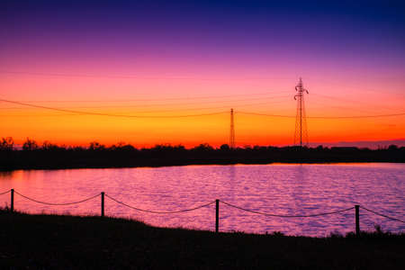 sunset on quiet waters of saltpan in Italyの写真素材