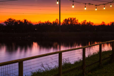 sunset on quiet waters of saltpan in Italyの写真素材