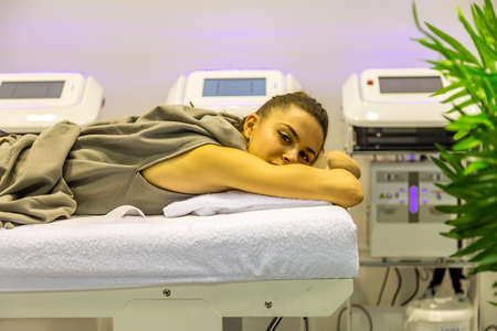 BOLOGNA (BO), ITALY - MARCH 18, 2019: exhibitor is waiting for visitors at COSMOPROF, trade show of the beauty industryのeditorial素材