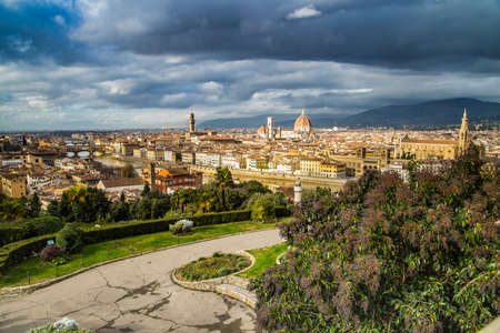 FLORENCE, ITALY - DECEMBER 15, 2019: tourists enjoying the stunning view of skyscape of Florence in Tuscany, Italyの写真素材