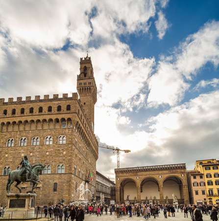 FLORENCE, ITALY - DECEMBER 15, 2019: tourists visiting Palazzo Vecchio in SIgnoria Square in Florence  in Tuscany, Italyのeditorial素材