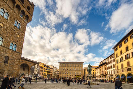 FLORENCE, ITALY - DECEMBER 15, 2019: tourists visiting Palazzo Vecchio in SIgnoria Square in Florence  in Tuscany, Italyのeditorial素材
