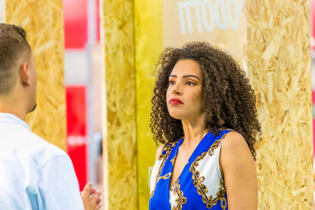 BOLOGNA (BO), ITALY - SEPTEMBER 6, 2019: exhibitor welcoming visitor at SANA 2019, 31st international exhibition of organic and natural productsのeditorial素材