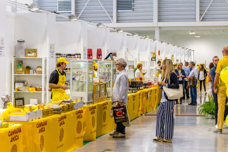 BOLOGNA (BO), ITALY - SEPTEMBER 6, 2019: exhibitor welcoming visitor at SANA 2019, 31st international exhibition of organic and natural productsのeditorial素材