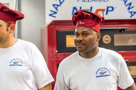 BOLOGNA (BO), ITALY - SEPTEMBER 6, 2019: pizza chef waiting for visitors at SANA 2019, 31st international exhibitionof organic and natural productsのeditorial素材