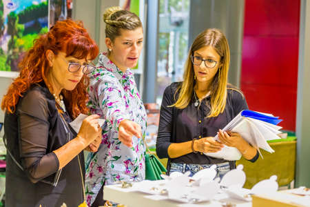 BOLOGNA (BO), ITALY - SEPTEMBER 6, 2019: exhibitor welcoming visitor at SANA 2019, 31st international exhibition of organic and natural productsのeditorial素材