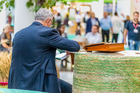 BOLOGNA (BO), ITALY - SEPTEMBER 6, 2019: visitor sitting and resting at SANA 2019, 31st international exhibitionof organic and natural productsのeditorial素材