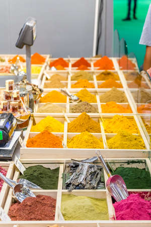 BOLOGNA (BO), ITALY - SEPTEMBER 6, 2019: light is enlightening spice powders at SANA 2019, 31st international exhibitionof organic and natural productsのeditorial素材