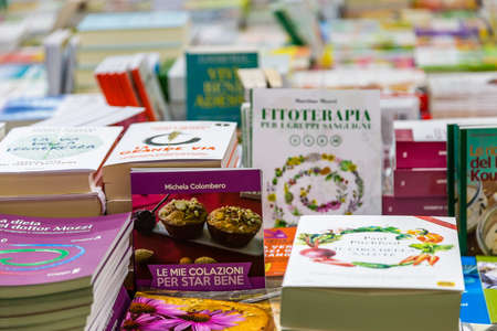 BOLOGNA (BO), ITALY - SEPTEMBER 6, 2019: lights are enlightening books at SANA 2019, 31st international exhibitionof organic and natural productsのeditorial素材
