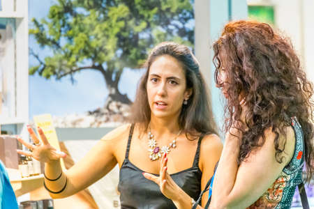 BOLOGNA (BO), ITALY - SEPTEMBER 6, 2019: exhibitor welcoming visitor at SANA 2019, 31st international exhibition of organic and natural productsのeditorial素材