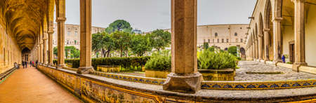 NAPLES, ITALY - JANUARY 4, 2020: tourists visiting the monumental complex of Santa Chiaraの写真素材