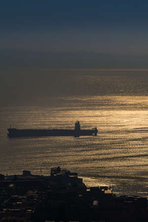 amazing view of the roofs of Napoli while vessel is passing in the Gulf of Naples under the sunの写真素材