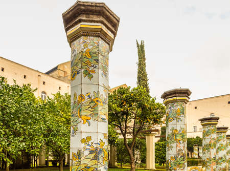 sunlight enlightening the Rococo majolica tiles of the cloister of the monumental complex of Santa Chiaraの写真素材