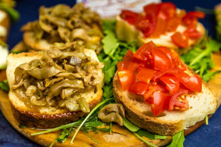 eggplant and tomatoes on bread with olive oilの写真素材
