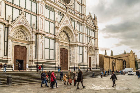 FLORENCE, ITALY - DECEMBER 15, 2019: tourists are visiting  Basilica di Santa Croce in Florence in...