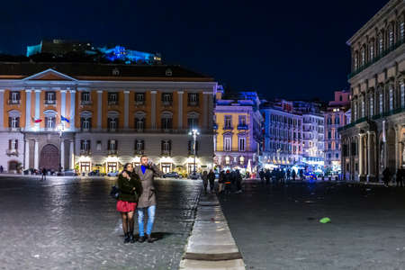 NAPLES, ITALY - JANUARY 5, 2020: tourists are visiting the street of the historical centerの写真素材