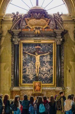 RAVENNA, ITALY - MAY 2, 2019: tourists in front of the Crucifixion of Jesus Christ visiting the ...