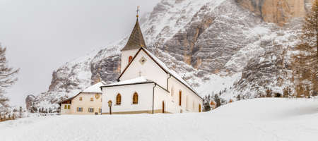 snow covering La Crusc Santa Croce Sanctuaryの写真素材