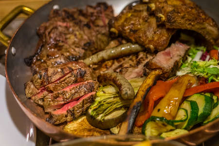 closeup of pan of mixed meats according to Italian cuisine in Badia, Trentino region