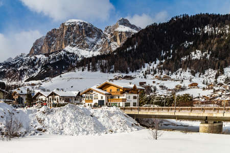 CORVARA (BZ), FEBRUARY 11, 2019: snow covering houses and mountainsのeditorial素材
