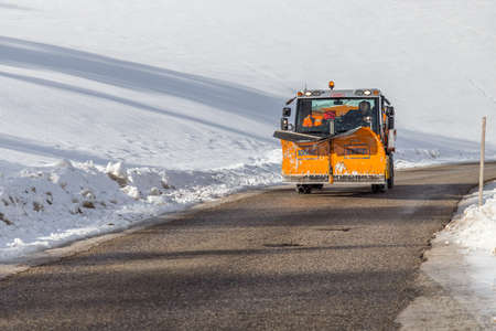 LA VILLA (BZ), FEBRUARY 11, 2019: snowplow running on road running though snowy fields