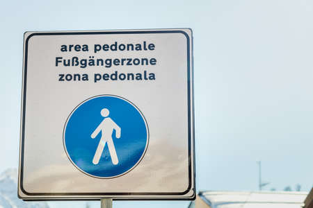 San Cassiano (BZ), February 12, 2019: sunlight is enlightening pedestrian zone signboardの写真素材