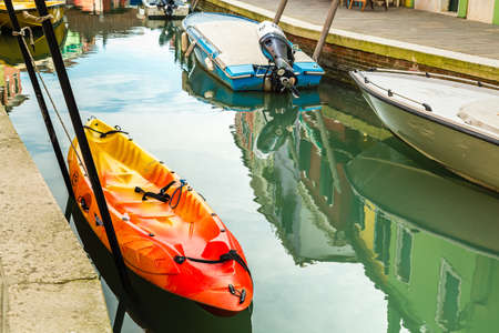 BURANO (VE), ITALY - FEBRUARY 21, 2020: waters flowing in channel along the colorful houses of the ancient fishing villageのeditorial素材