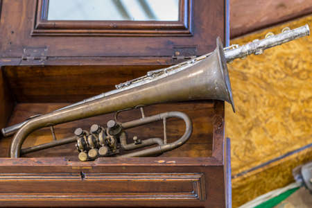 CESENA (FC) - FEBRUARY 17, 2019: lights are enlightening old trumpet for sale on stalls at antique...