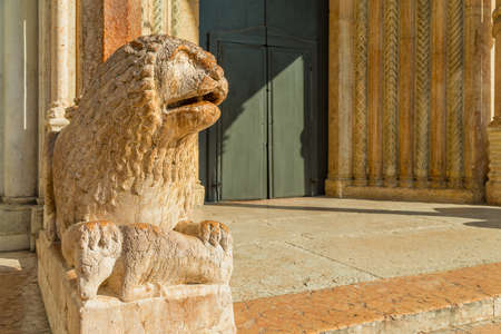 MODENA (MO), ITALY - FEBRUARY 15, 2019: light is enlightening statue of lion of the Cathedral of Modenaのeditorial素材