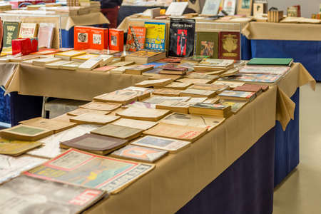 CESENA (FC) - FEBRUARY 16, 2020: lights are enlightening ancient and old books for sale at antiques fairのeditorial素材