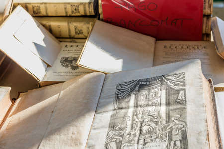 CESENA (FC) - FEBRUARY 16, 2020: lights are enlightening ancient and old books for sale at antiques fairのeditorial素材