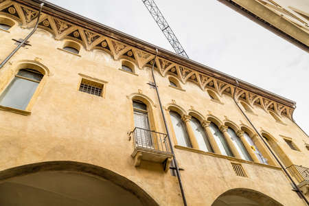 PADOVA, ITALY - FEBRUARY 23, 2019: sunlight is enlightening typical architecture of buildings in historical center in Padovaのeditorial素材