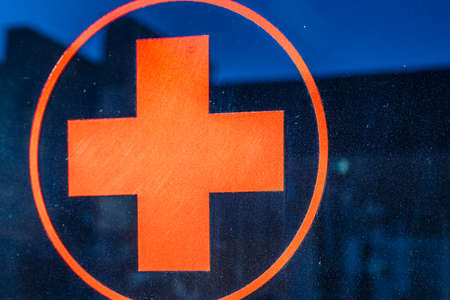 CESENA (FC) - FEBRUARY 17, 2019: lights are enlightening red cross sign on van in antique fairのeditorial素材