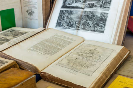 CESENA (FC) - FEBRUARY 16, 2020: lights are enlightening ancient and old books for sale at antiques fairのeditorial素材