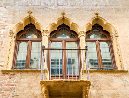 PADOVA, ITALY - FEBRUARY 23, 2019: sunlight is enlightening typical architecture of buildings in historical center in Padovaのeditorial素材