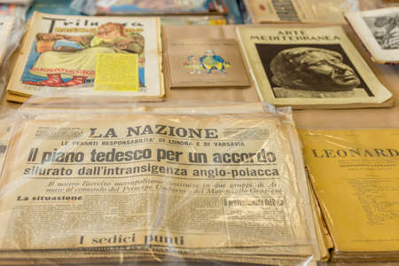 CESENA (FC) - FEBRUARY 16, 2020: lights are enlightening ancient and old books for sale at antiques fairのeditorial素材
