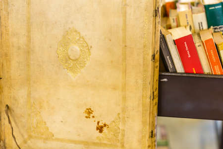 CESENA (FC) - FEBRUARY 16, 2020: lights are enlightening ancient and old books for sale at antiques fairのeditorial素材