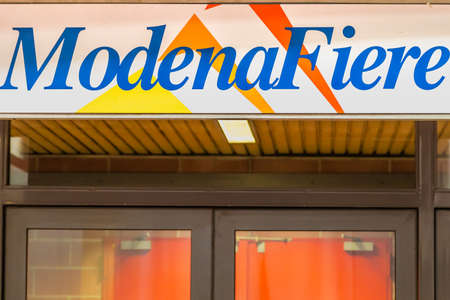 MODENA (MO), ITALY - FEBRUARY 15, 2019: sunlight is enlightening ModenaFiere logo on the entry of...