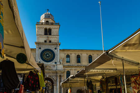 PADOVA, ITALY - FEBRUARY 23, 2019: people going for shopping in typical market in Piazza dei Signori