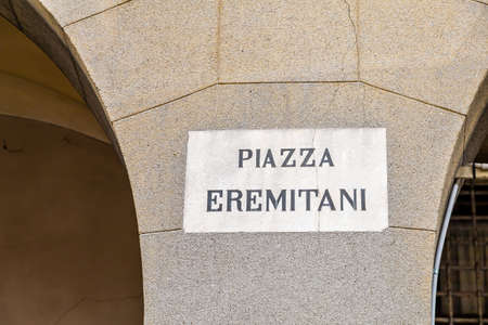PADOVA, ITALY - FEBRUARY 23, 2019: sunlight is enlightening Ermitani Square  sign in historical center in Padovaのeditorial素材