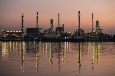 Petroleum oil refinery beside the river at nightのeditorial素材