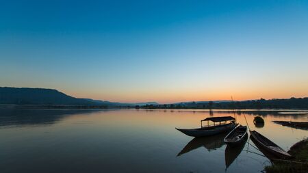 silhouette of fishing boat in Mekong river の写真素材