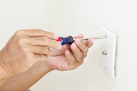 Man hand with screwdriver